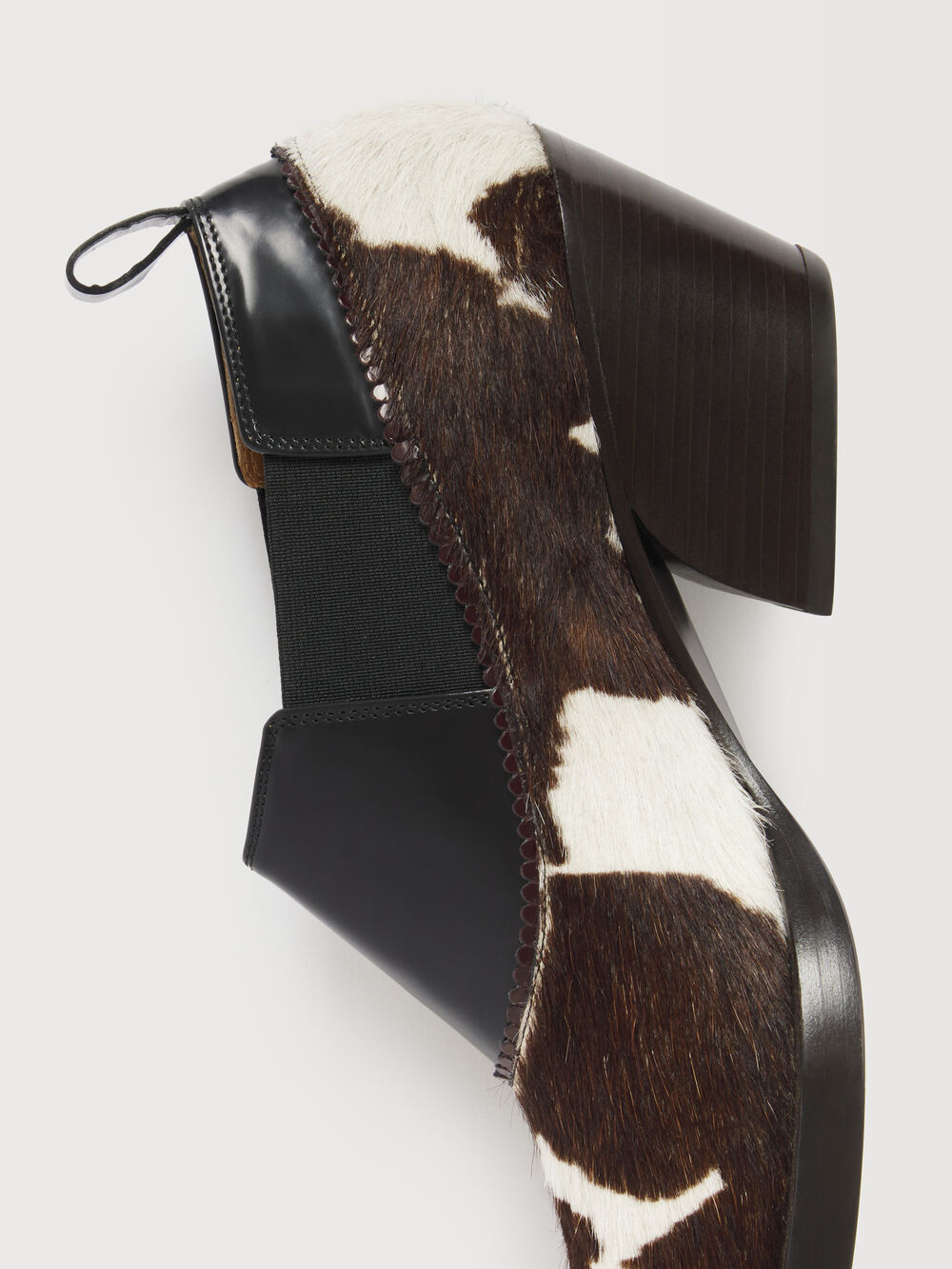 Cow-print pony hair detail and sculptural heel