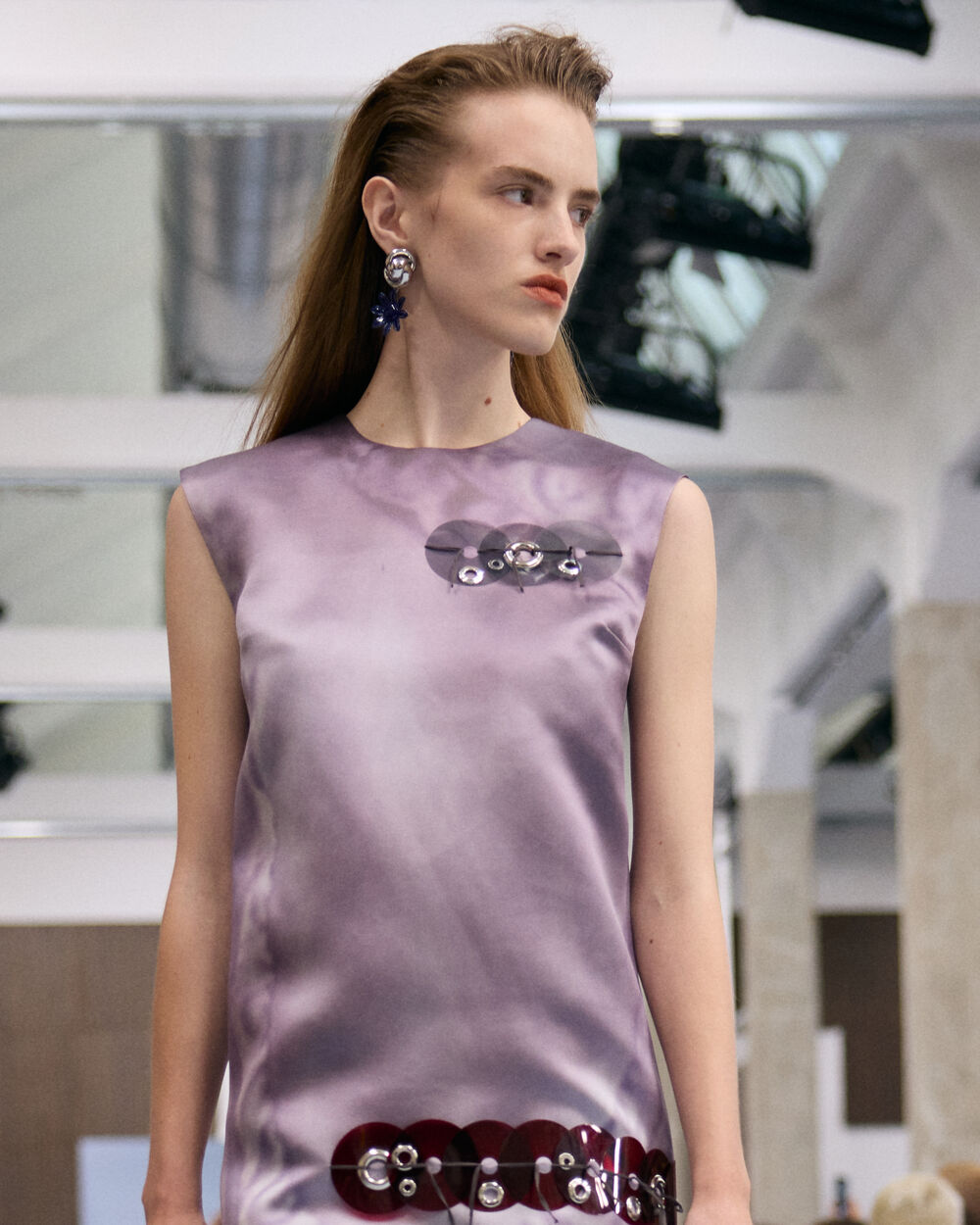 Model wearing a lilac Marni sleeveless dress with decorative embellishments
