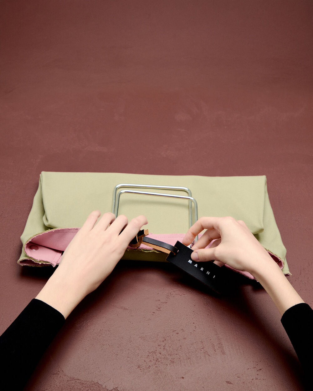 Light beige Marni tote bag with metal top handles and leather tag detail