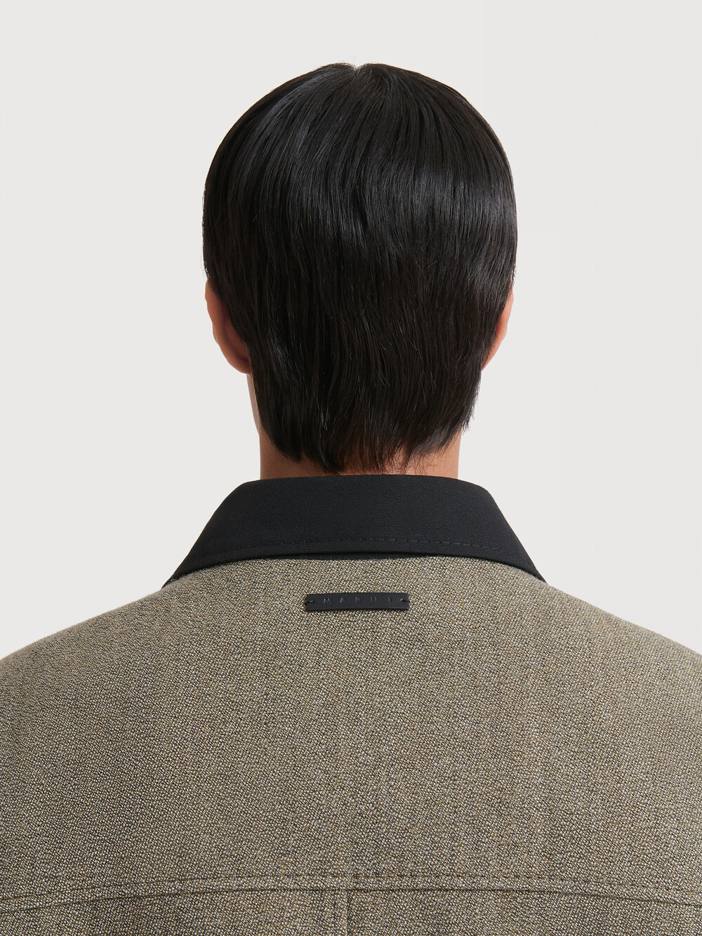 Tweed Marni jacket with contrasting black collar and logo plaque on the back