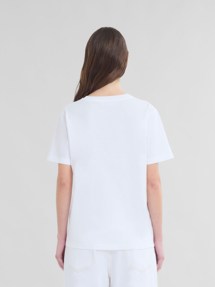T-shirt in cotone biologico bianco con applicazione a fiore - T-shirt - Image 3