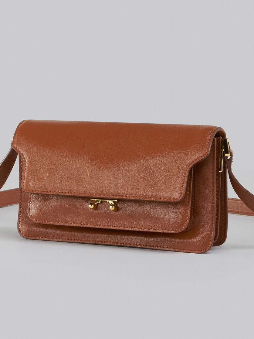 Brown leather E/W Soft Trunk Bag with logo strap
