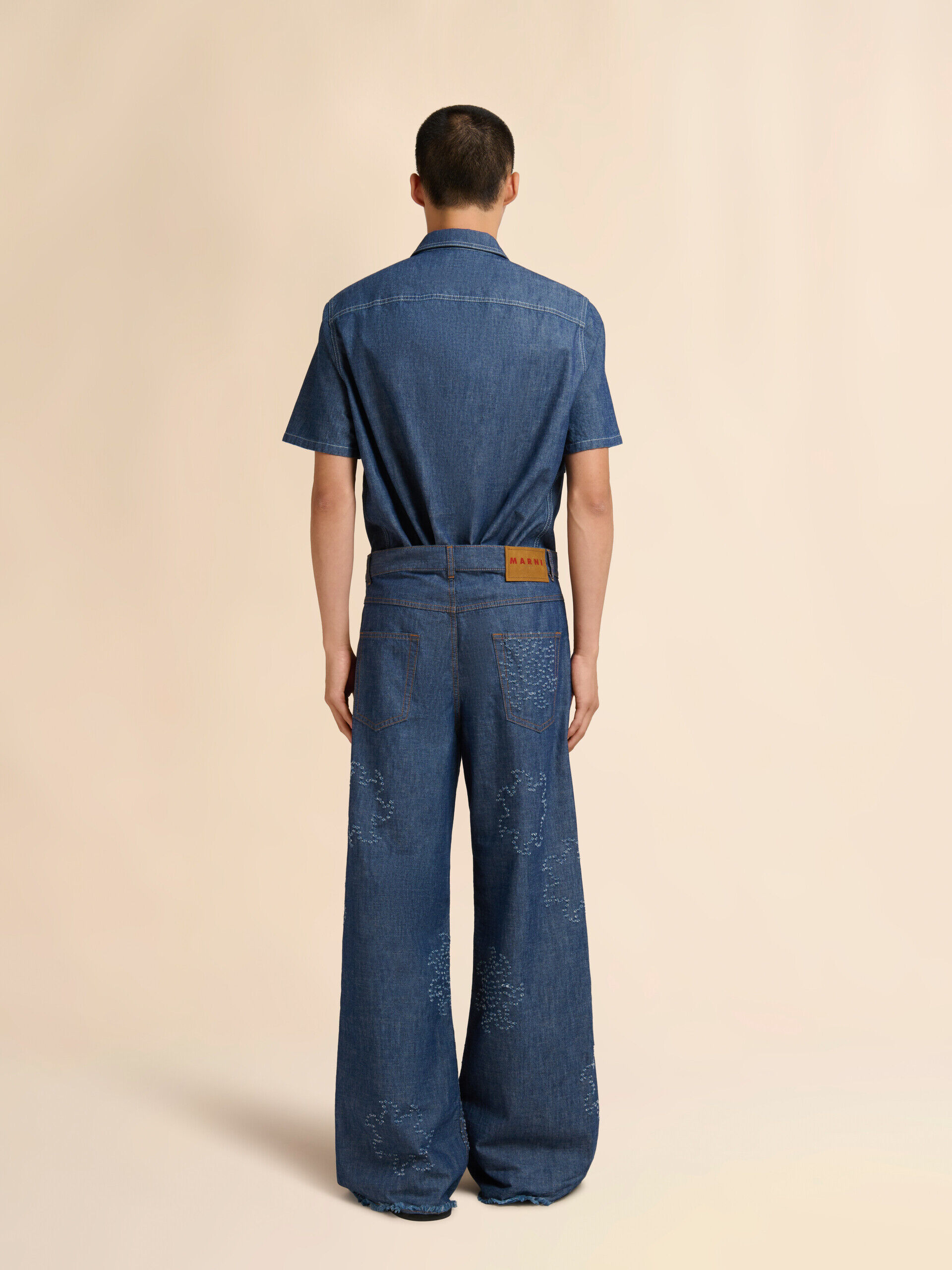 Blue chambray jeans with frayed sun motif | Marni