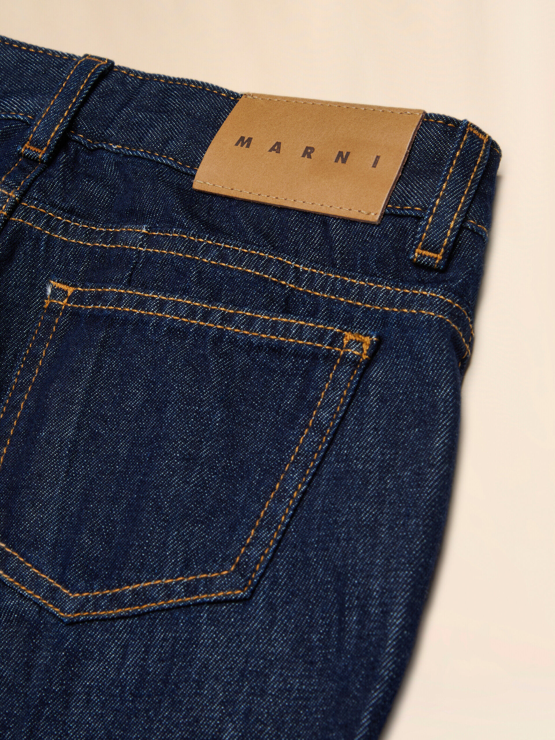 Deep blue denim jeans with tobacco stitching | Marni