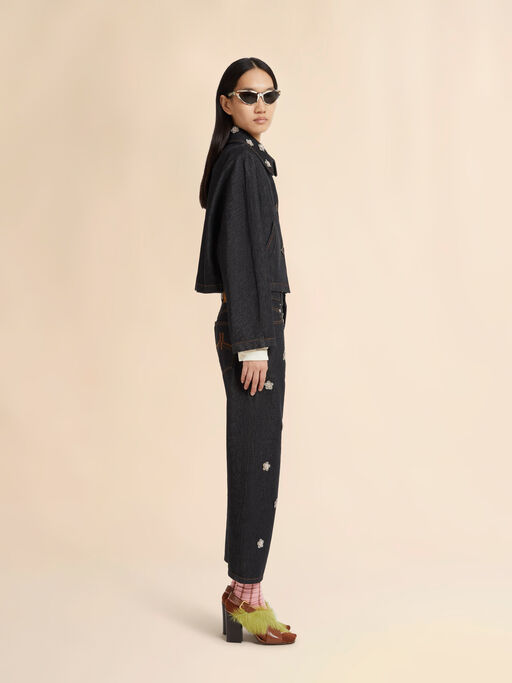 Black denim jeans with daisy appliqués - Pants