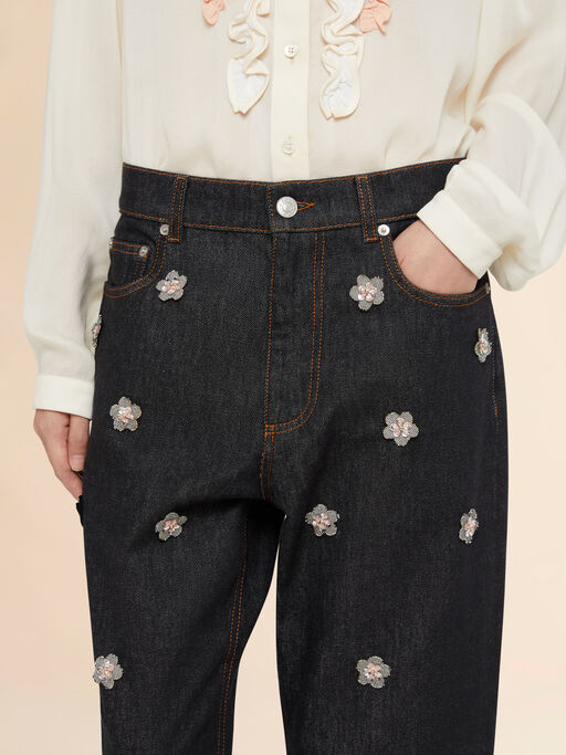 Black denim jeans with daisy appliqués - Pants