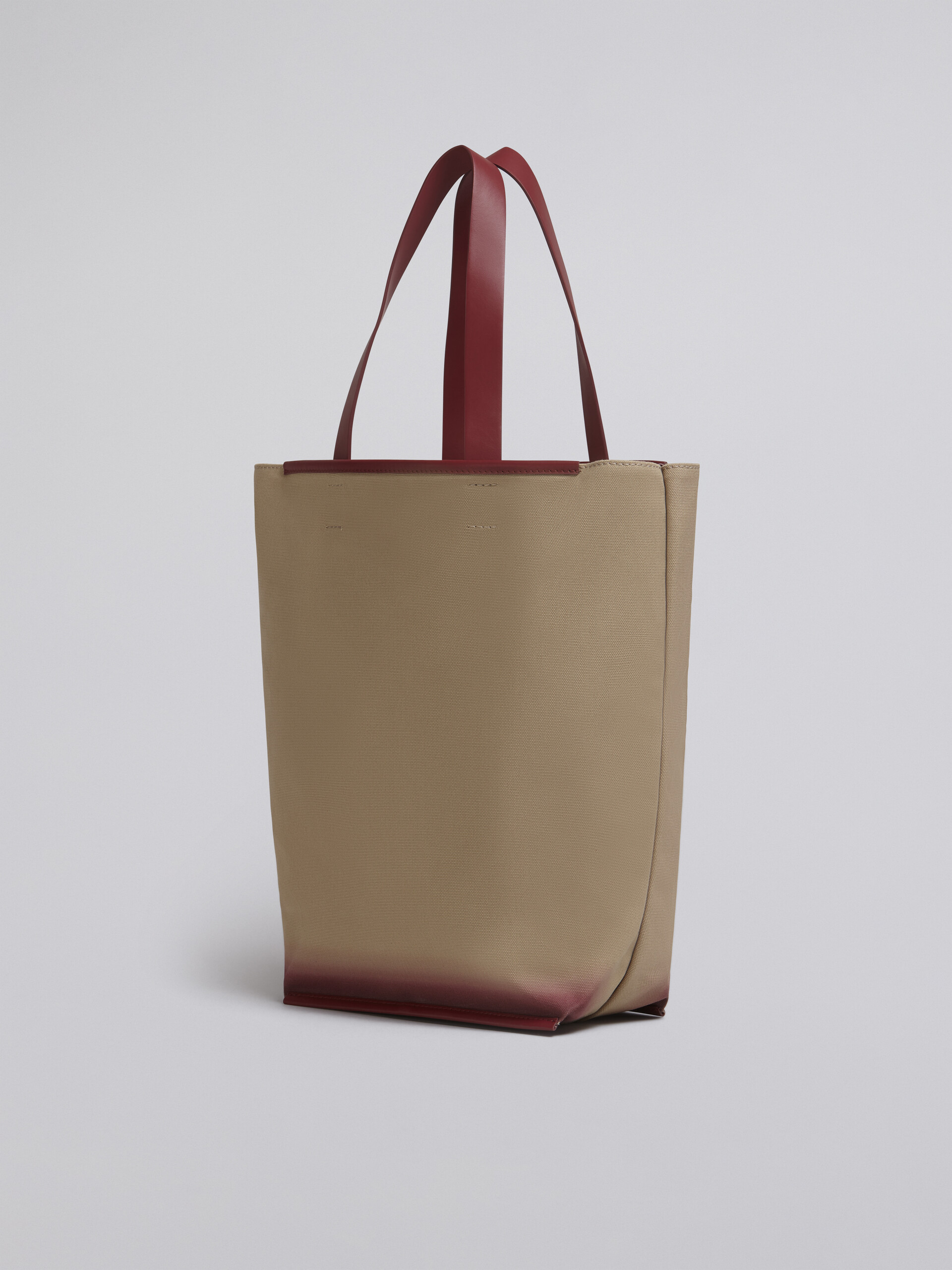 North-South cotton canvas shopping bag with outline bordeaux sprayed motif - Shopping Bags - Image 3