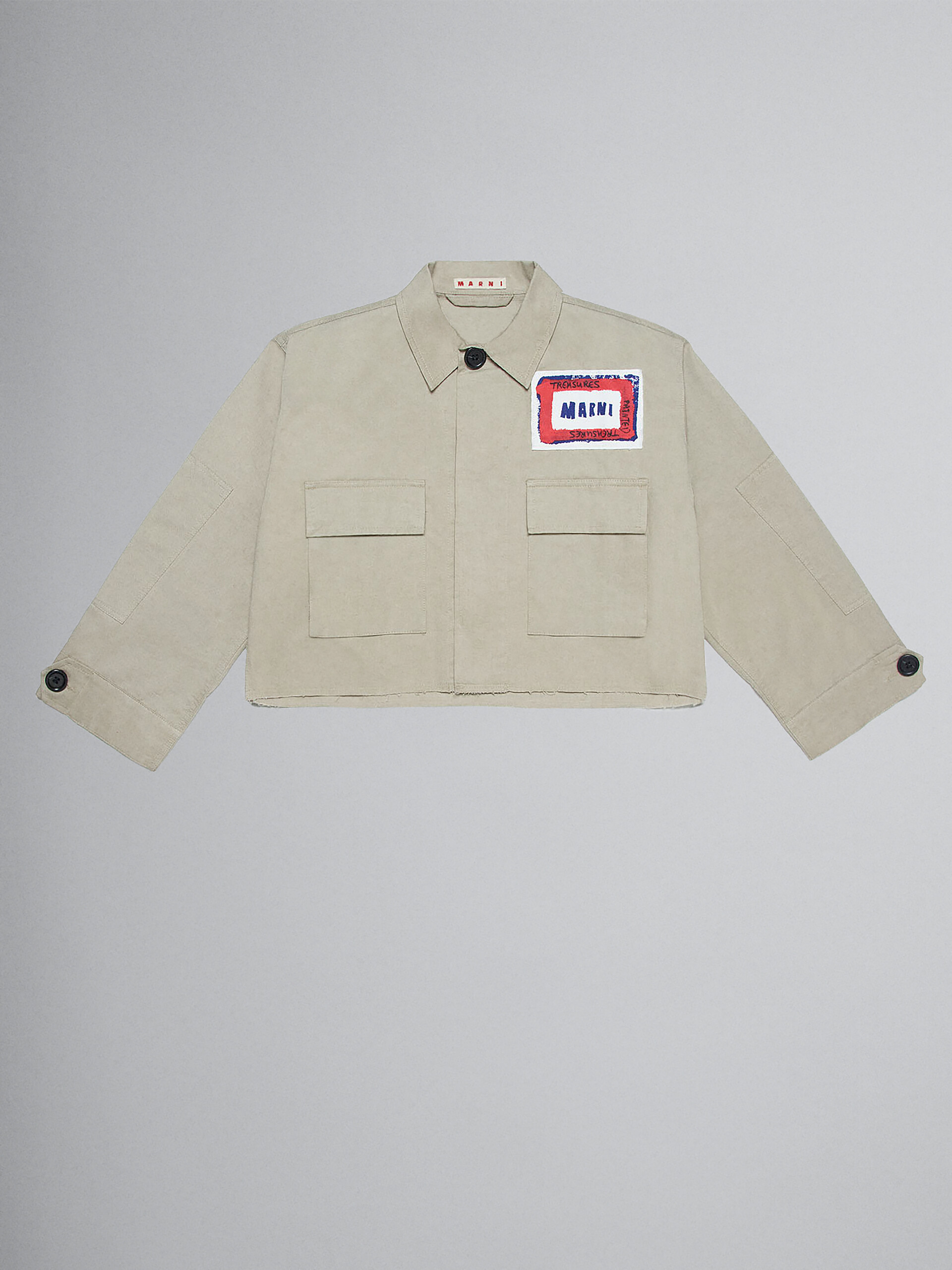 Short beige gabardine jacket with printed face - Jackets - Image 1