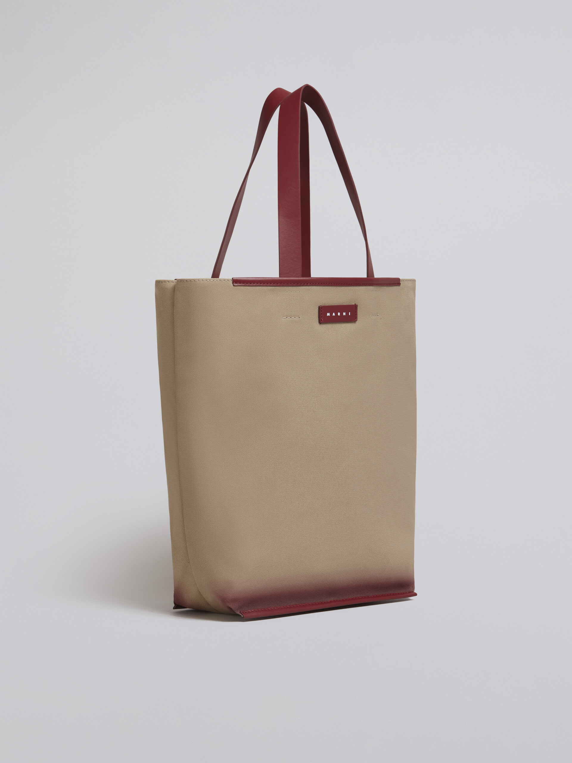North-South cotton canvas shopping bag with outline bordeaux sprayed motif - Shopping Bags - Image 6