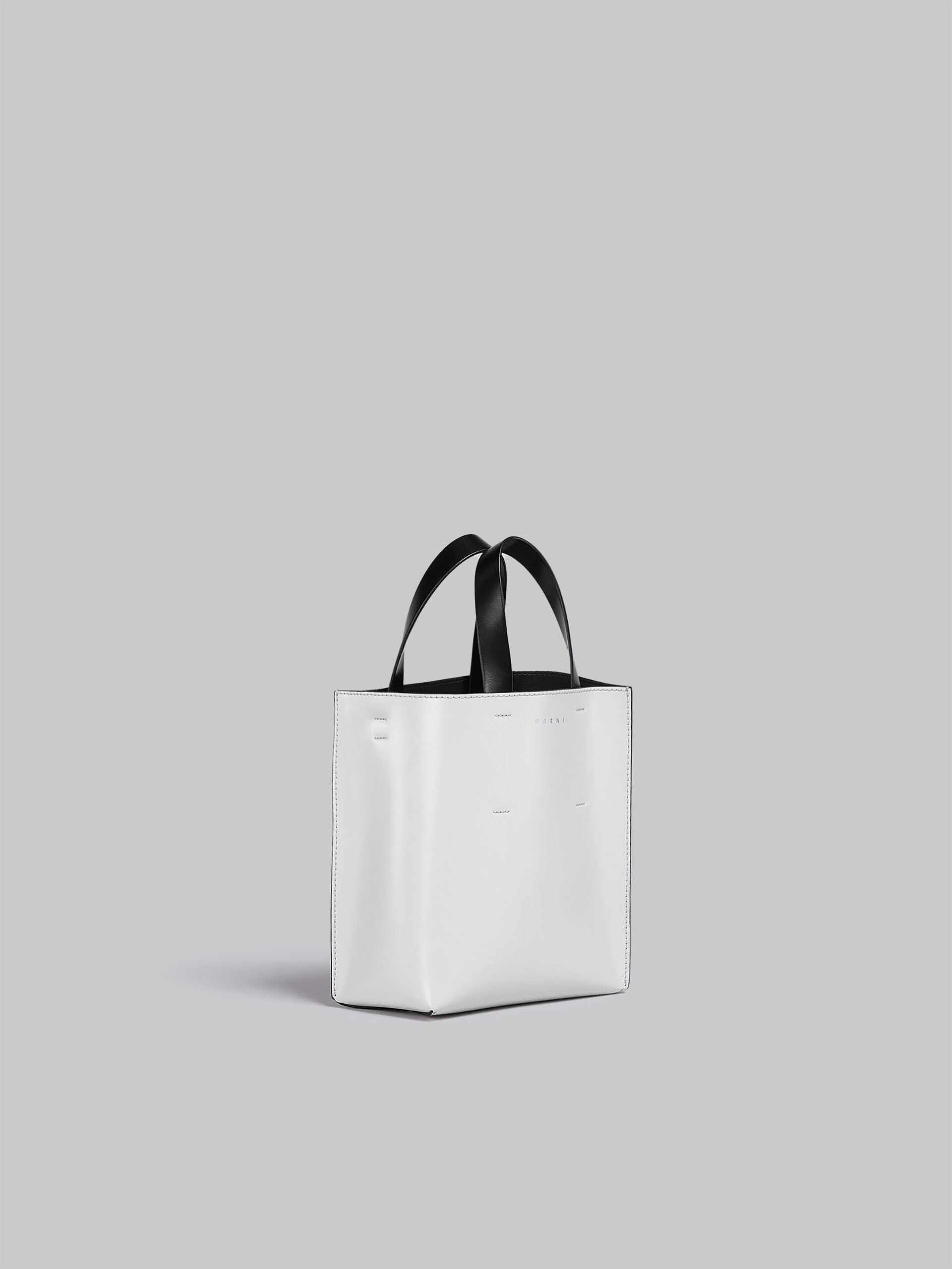 MUSEO mini bag in white and black leather