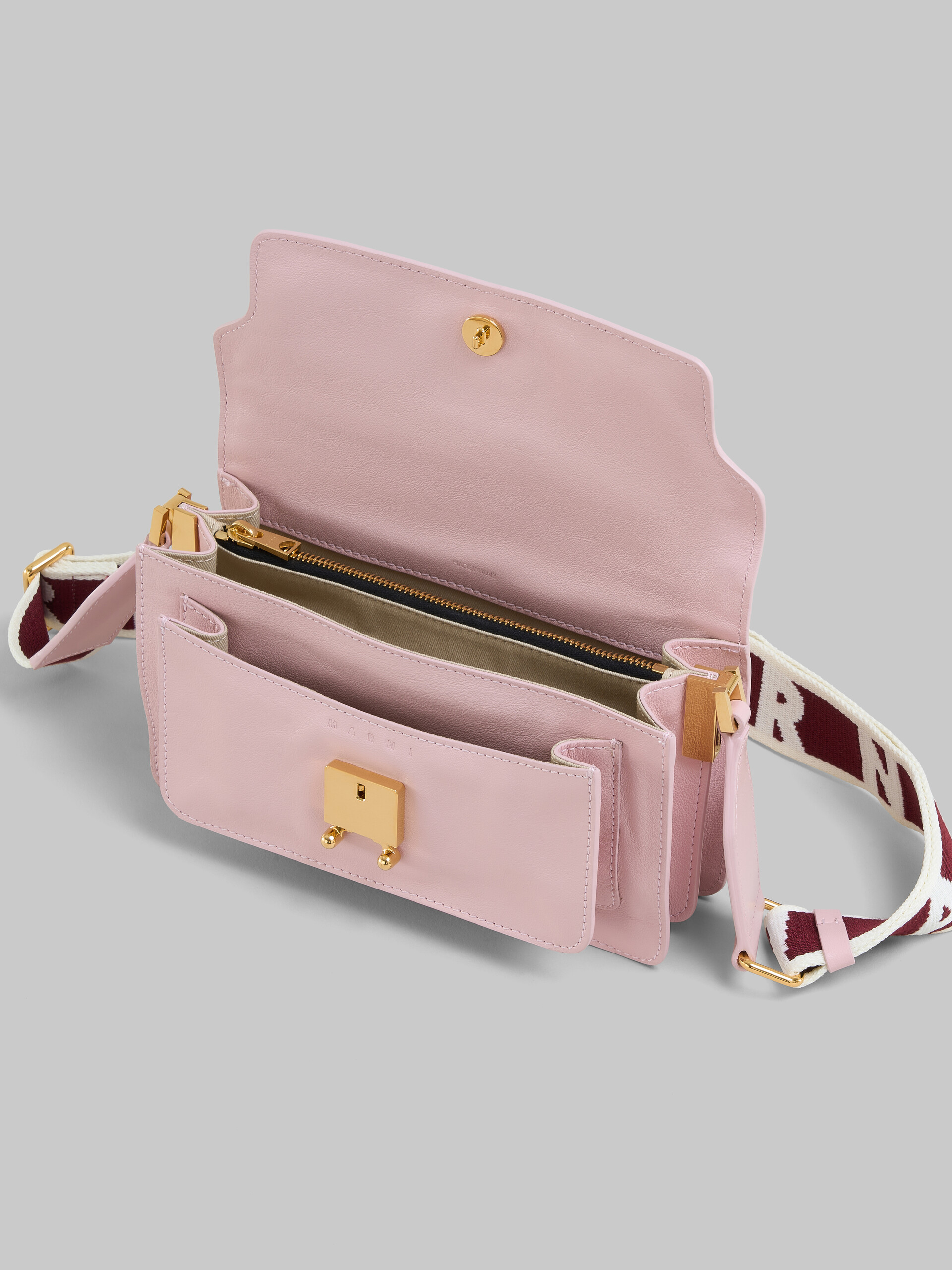 Pink leather E/W Soft Trunk Bag with logo strap