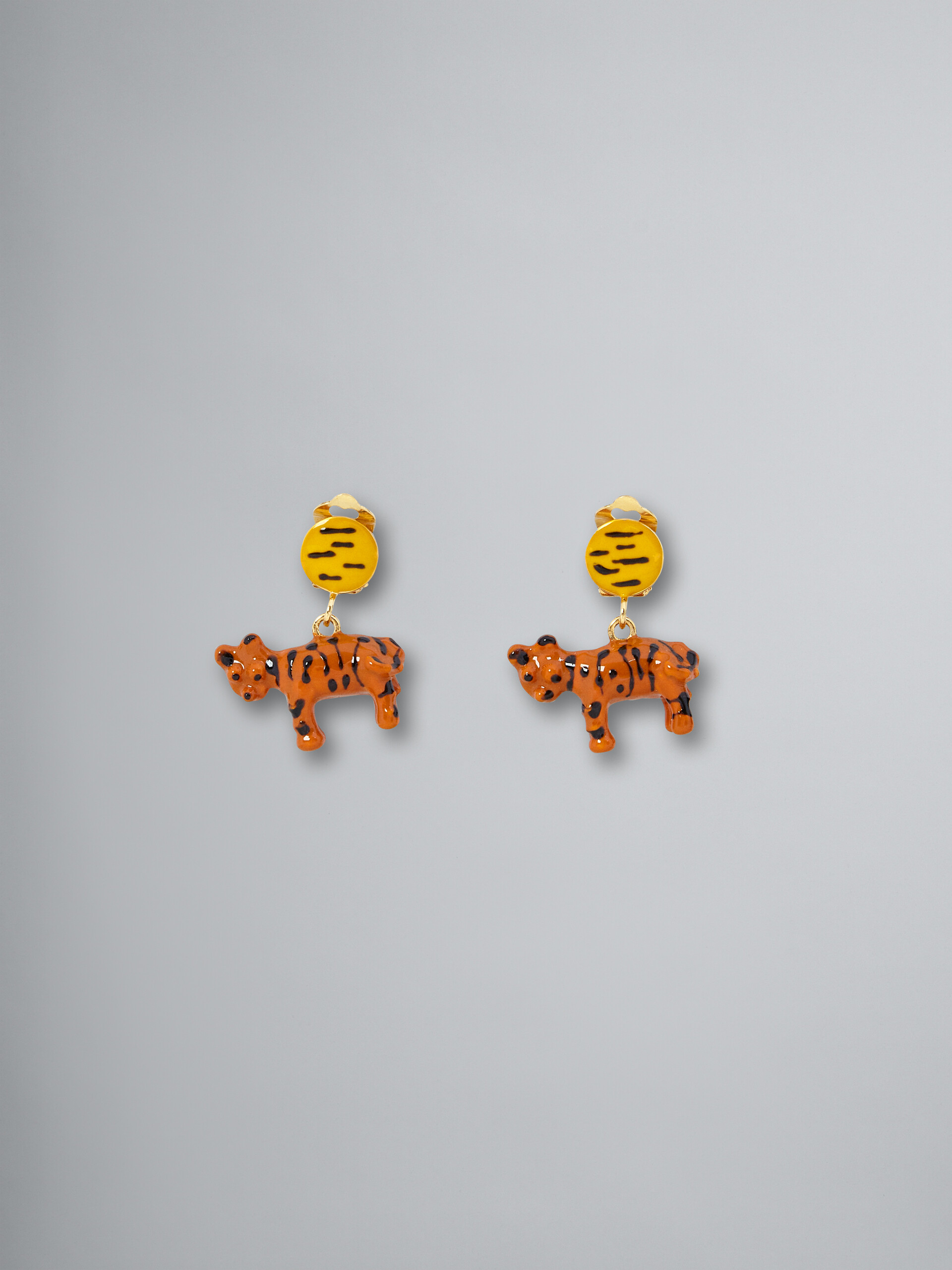 NAIF TIGER clip-on earrings in metal and resin
