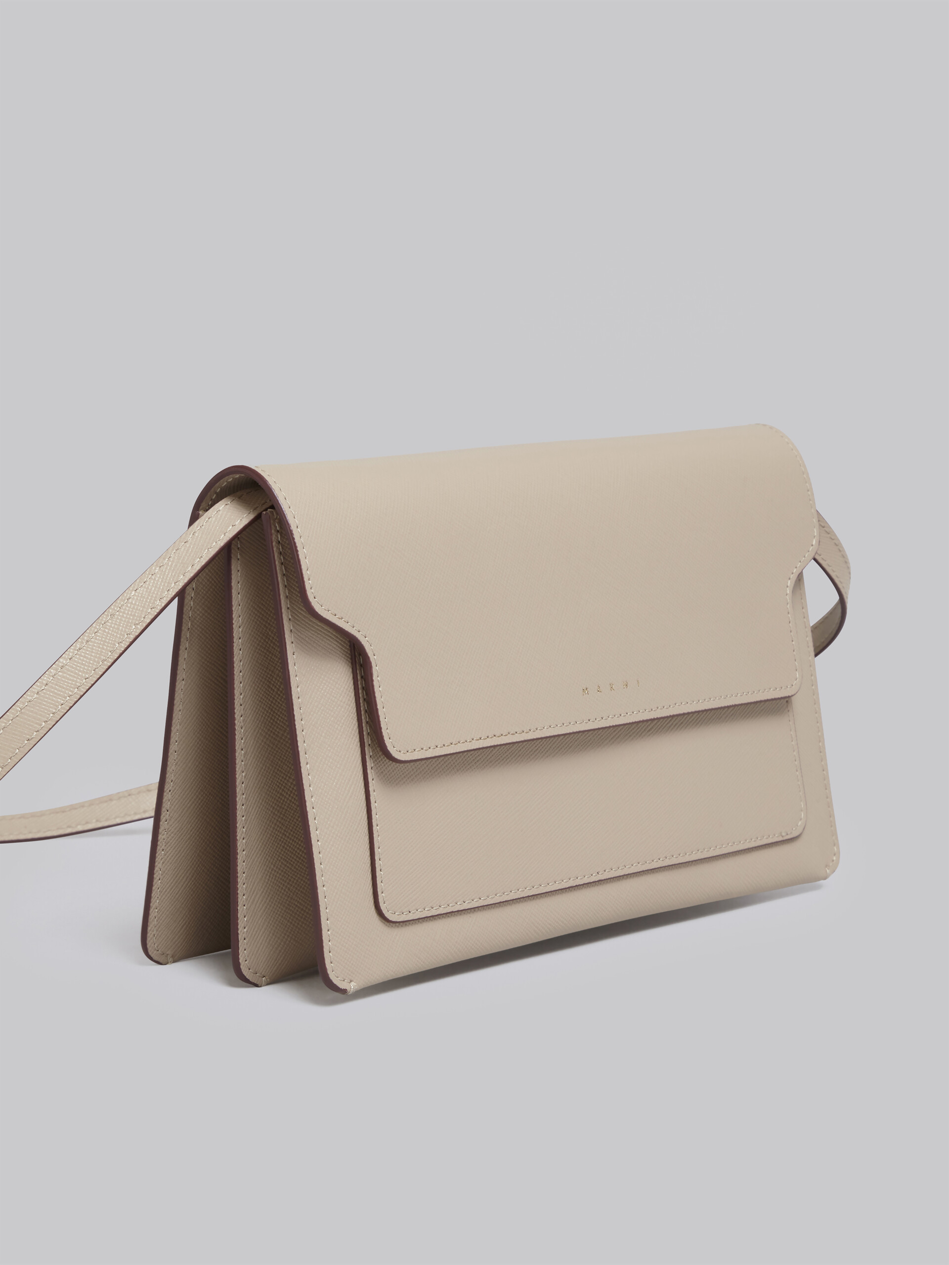 TRUNK clutch bag in beige saffiano leather