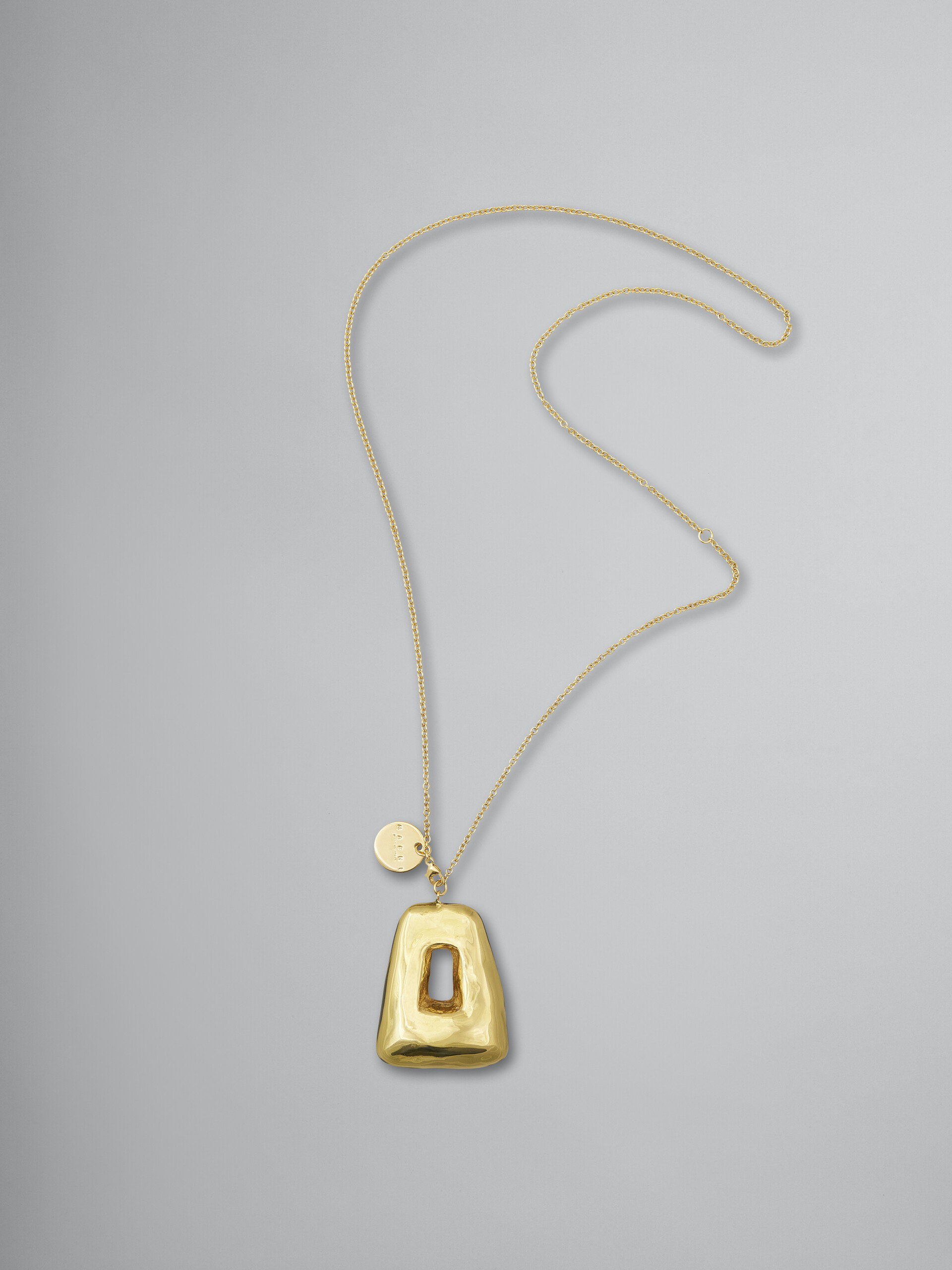 Goldfarbene TRAPEZE Metall-Halskette mit transparentem, emailliertem Anhänger - Halsketten - Image 1
