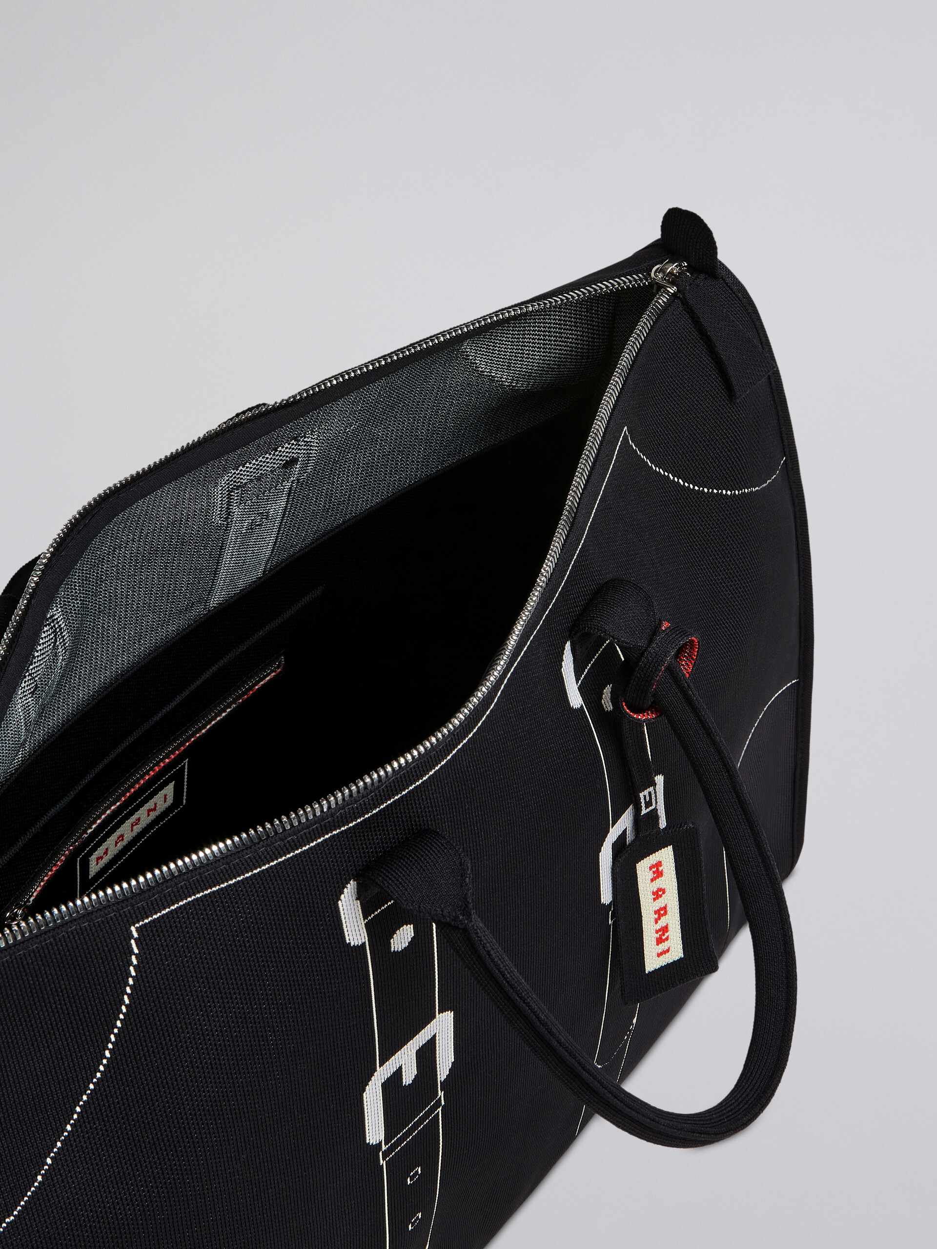 Black trompe-l'œil jacquard travel bag - Travelling Bag - Image 4